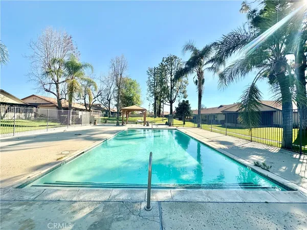 a view of swimming pool with chairs