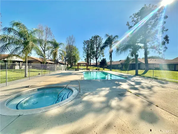 a view of a swimming pool with a yard