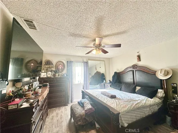 a bedroom with furniture and a chandelier