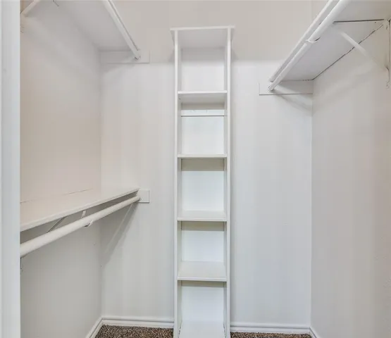 a view of an empty walk in closet