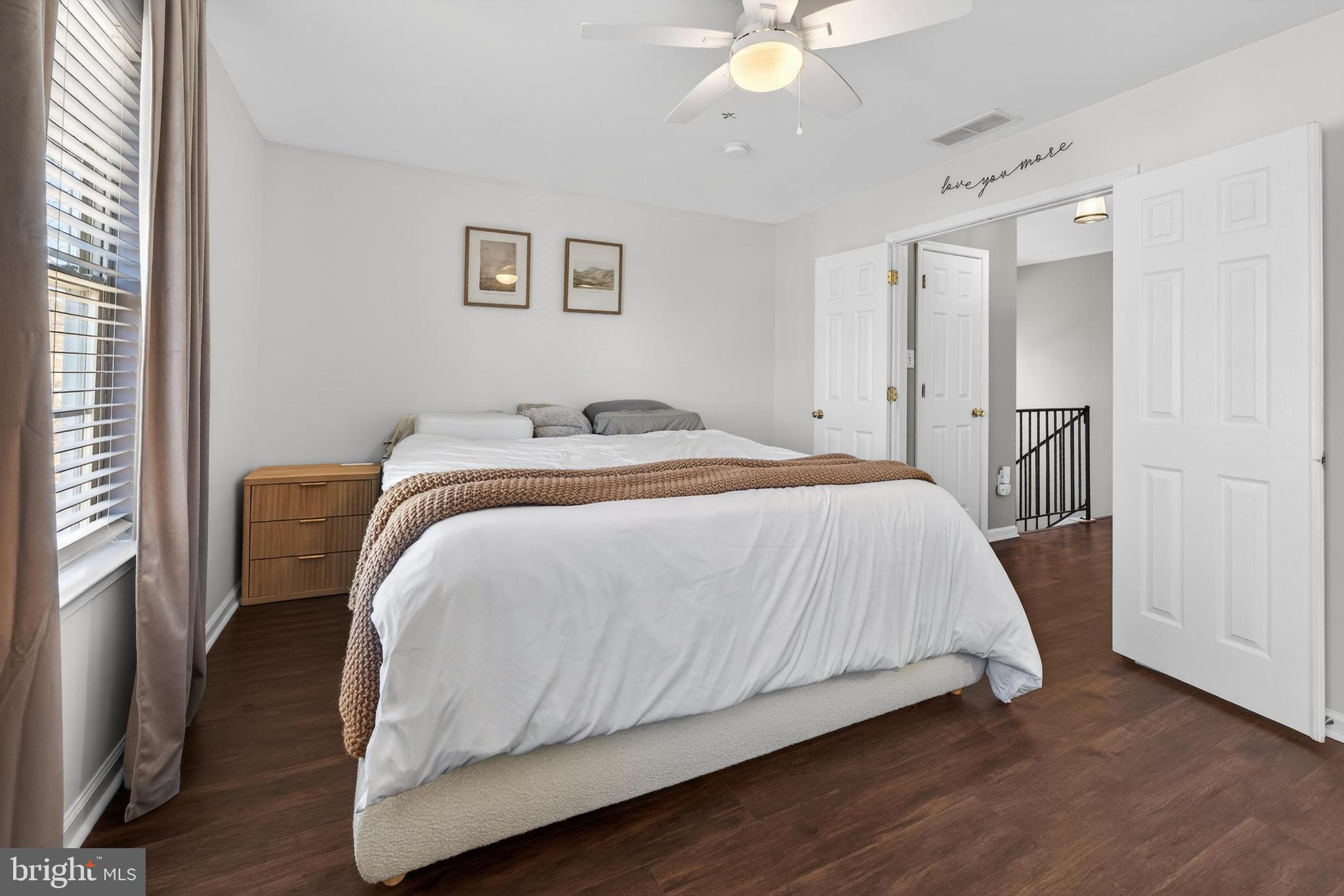 137 Pendragon Way Mantua, NJ 08051 - Photo 11 of 25 a bedroom with a bed and a chandelier
