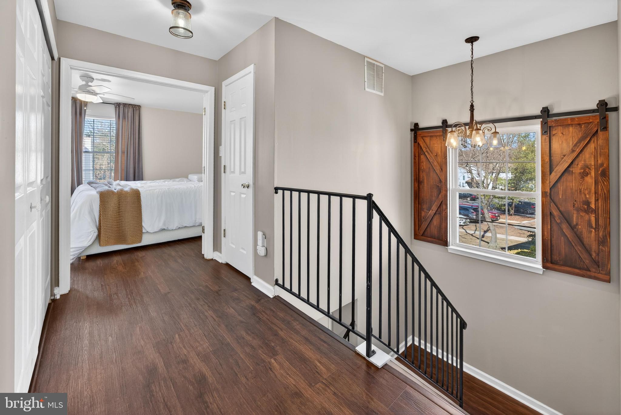 137 Pendragon Way Mantua, NJ 08051 - Photo 14 of 25 a view of a hallway with wooden floor and windows