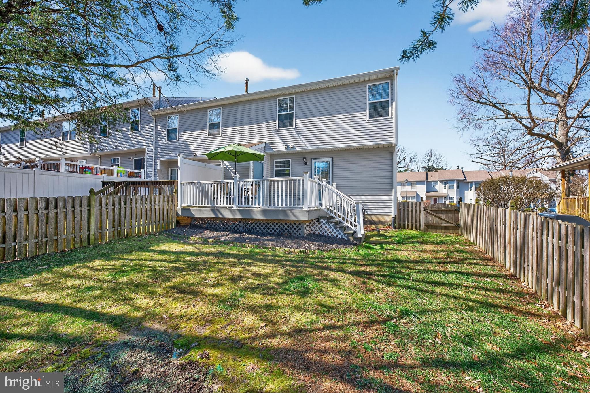 137 Pendragon Way Mantua, NJ 08051 - Photo 24 of 25 a view of a house with a small yard and wooden fence