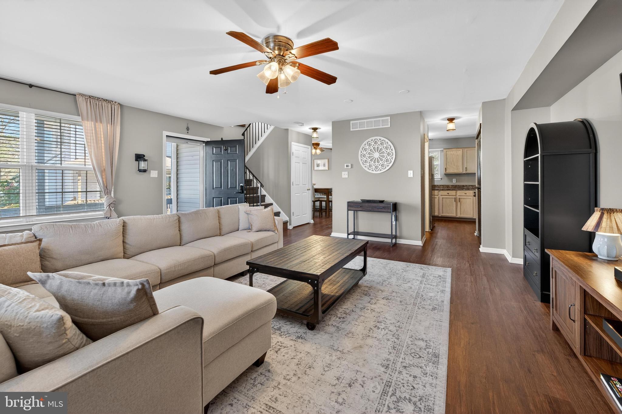 137 Pendragon Way Mantua, NJ 08051 - Photo 4 of 25 a living room with furniture a fireplace and a flat screen tv