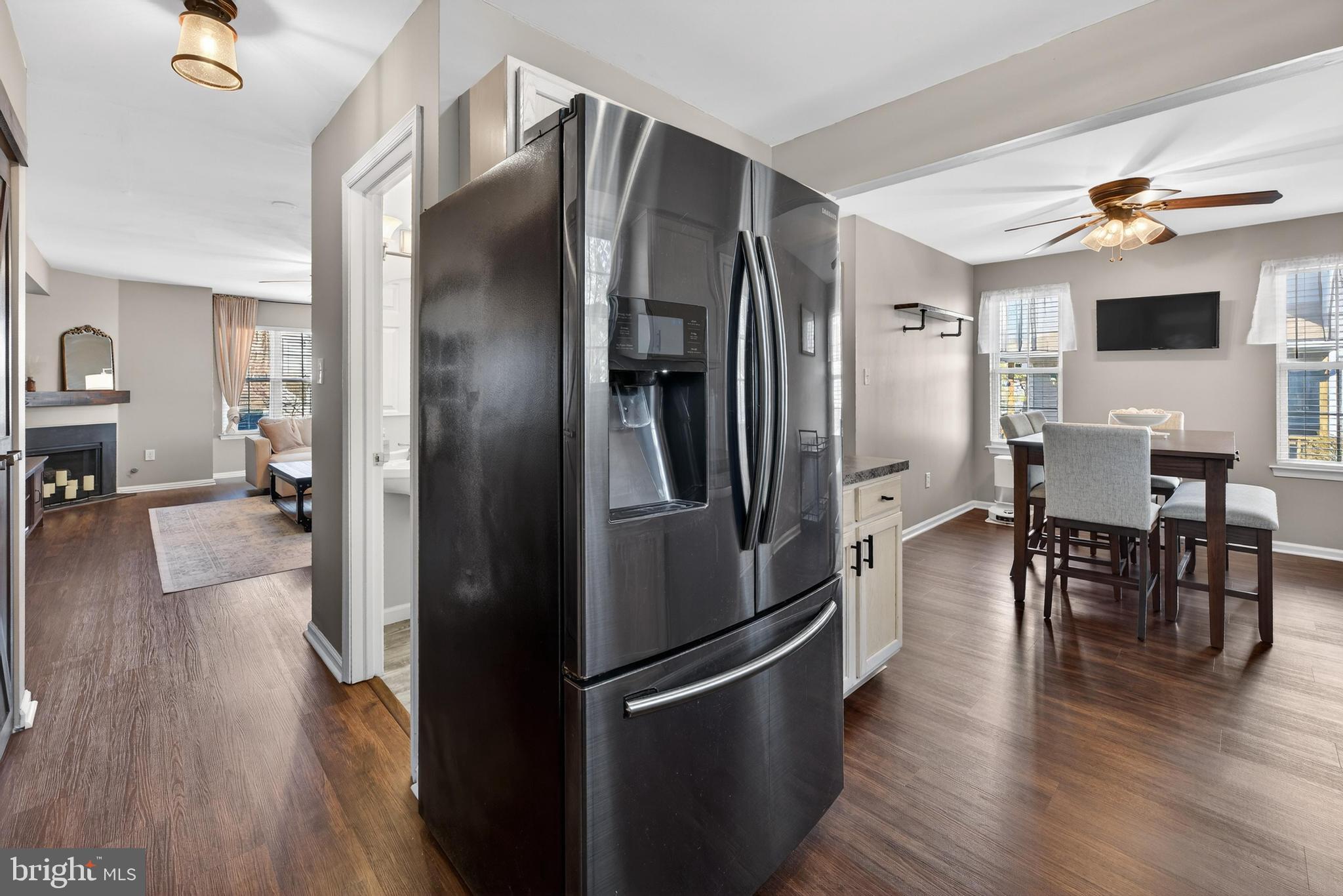 137 Pendragon Way Mantua, NJ 08051 - Photo 10 of 25 a kitchen with stainless steel appliances a refrigerator stove and wooden floor
