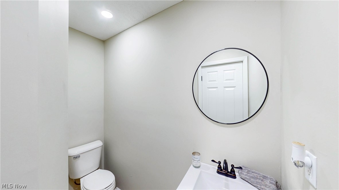 3312 Bancroft Road Akron, OH 44333 - Photo 10 of 50 Half bath featuring toilet and a sink