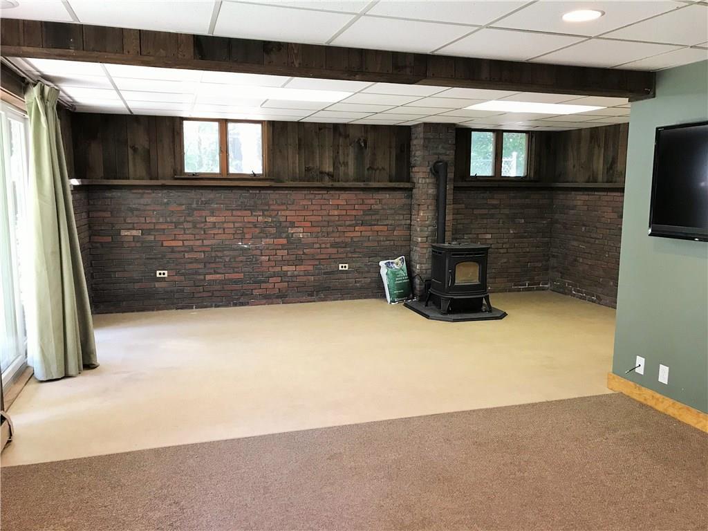 103 Rideout Lane Gardiner, ME 04345 - Photo 31 of 35 Family room also has a pellet stove.