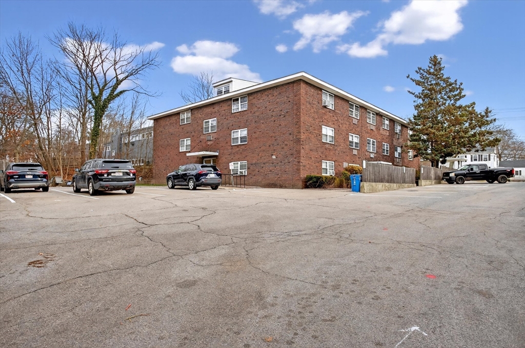881 Main Street, Unit 9 Walpole, MA 02081 - Photo 1 of 23 a view of a cars parked in front of a building