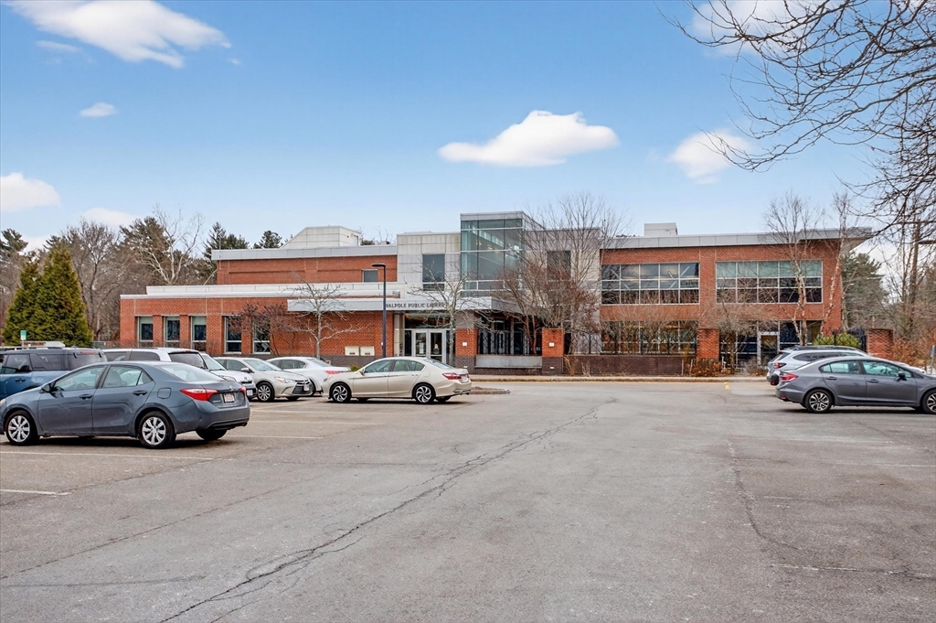 881 Main Street, Unit 9 Walpole, MA 02081 - Photo 18 of 23 a car parked in front of a building