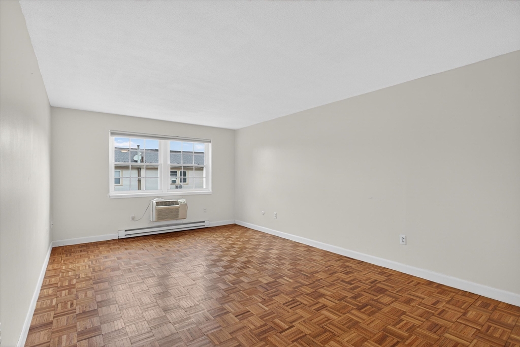 881 Main Street, Unit 9 Walpole, MA 02081 - Photo 4 of 23 an empty room with windows