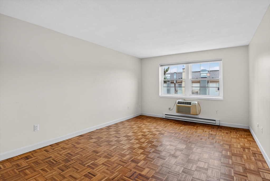 881 Main Street, Unit 9 Walpole, MA 02081 - Photo 6 of 25 an empty room with windows