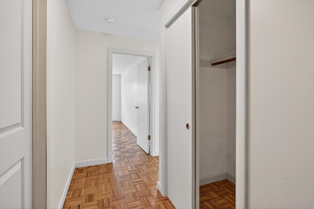881 Main Street, Unit 9 Walpole, MA 02081 - Photo 8 of 25 a view of a hallway with small space and bedroom