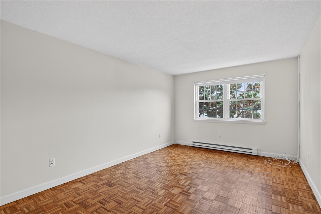 881 Main Street, Unit 9 Walpole, MA 02081 - Photo 9 of 25 an empty room with windows