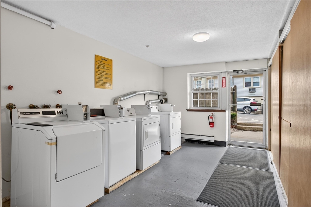 881 Main Street, Unit 9 Walpole, MA 02081 - Photo 10 of 23 a room that has a bed and a cabinets