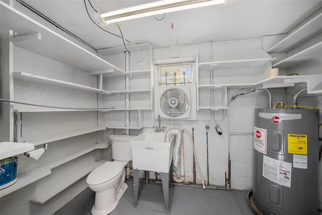 a view of a storage & utility room with racks a window