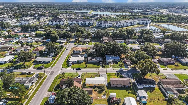 an aerial view of residential houses with outdoor space