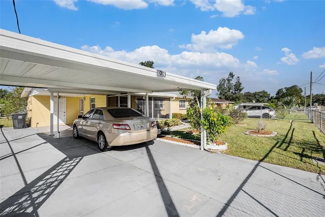 a view of balcony with couch and chairs