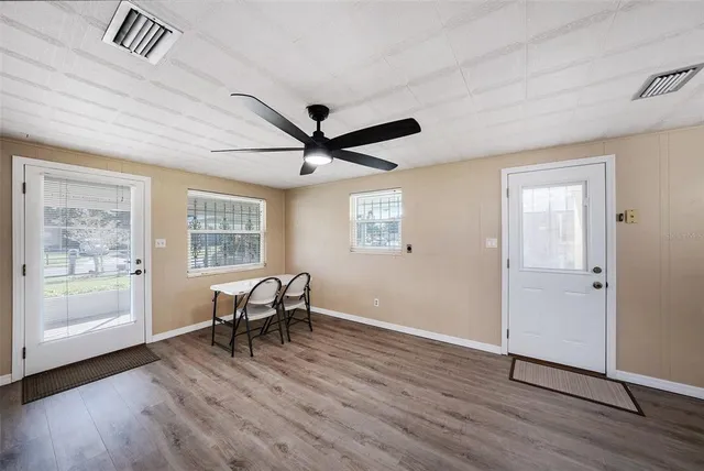 a view of a livingroom with furniture and windows