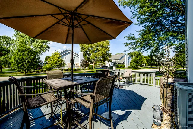 a view of a table and chairs under an umbrella