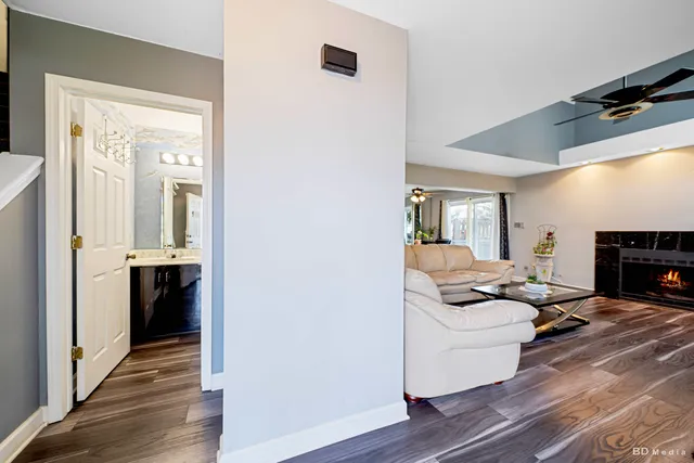 a living room with furniture and a fireplace