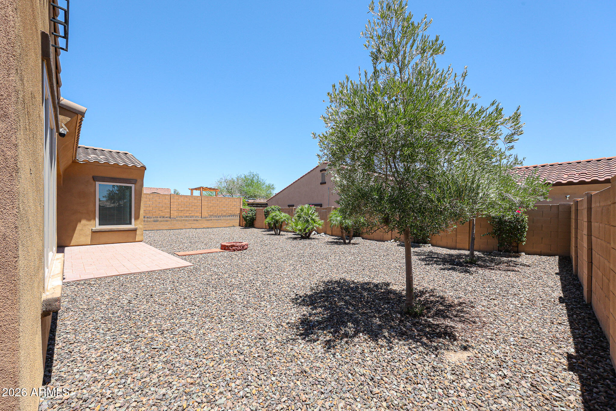 18175 West Narramore Road Goodyear, AZ 85338 - Photo 37 of 72 a view of a house with a yard