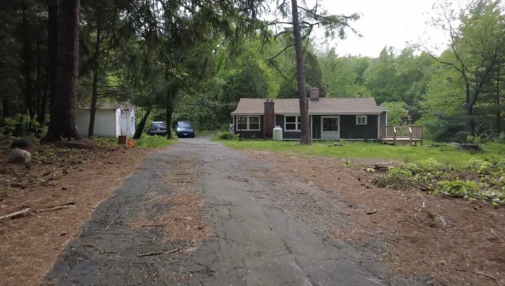 32 Hollow Road Wales, MA 01081 - Photo 35 of 35 a front view of a house with a yard and trees