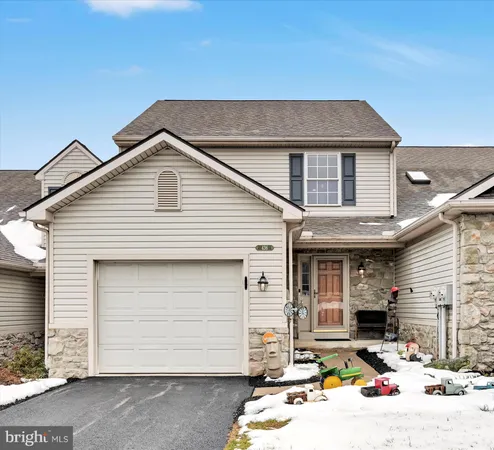 a front view of a house with garage