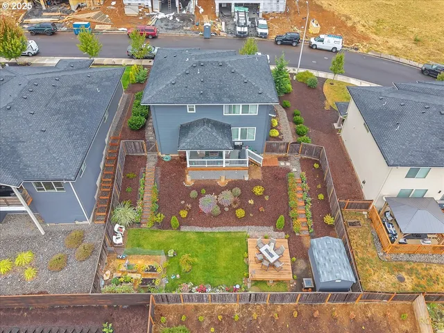 an aerial view of a house with outdoor space