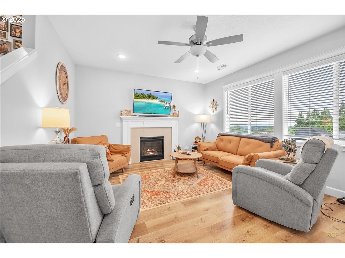 35560 Valley View Drive St. Helens, OR 97051 - Photo 15 of 47 a living room with furniture a large window and a fireplace
