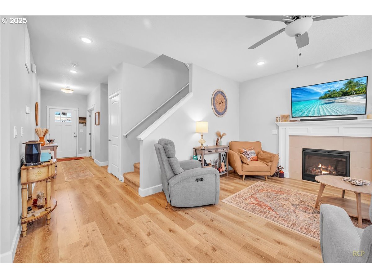 35560 Valley View Drive St. Helens, OR 97051 - Photo 17 of 47 a living room with furniture a fireplace and a flat screen tv