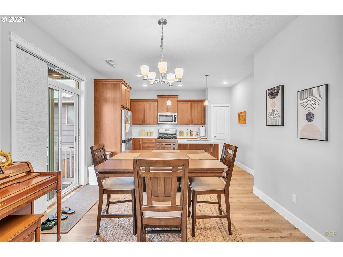 35560 Valley View Drive St. Helens, OR 97051 - Photo 19 of 47 a view of a dining room with furniture and chandelier