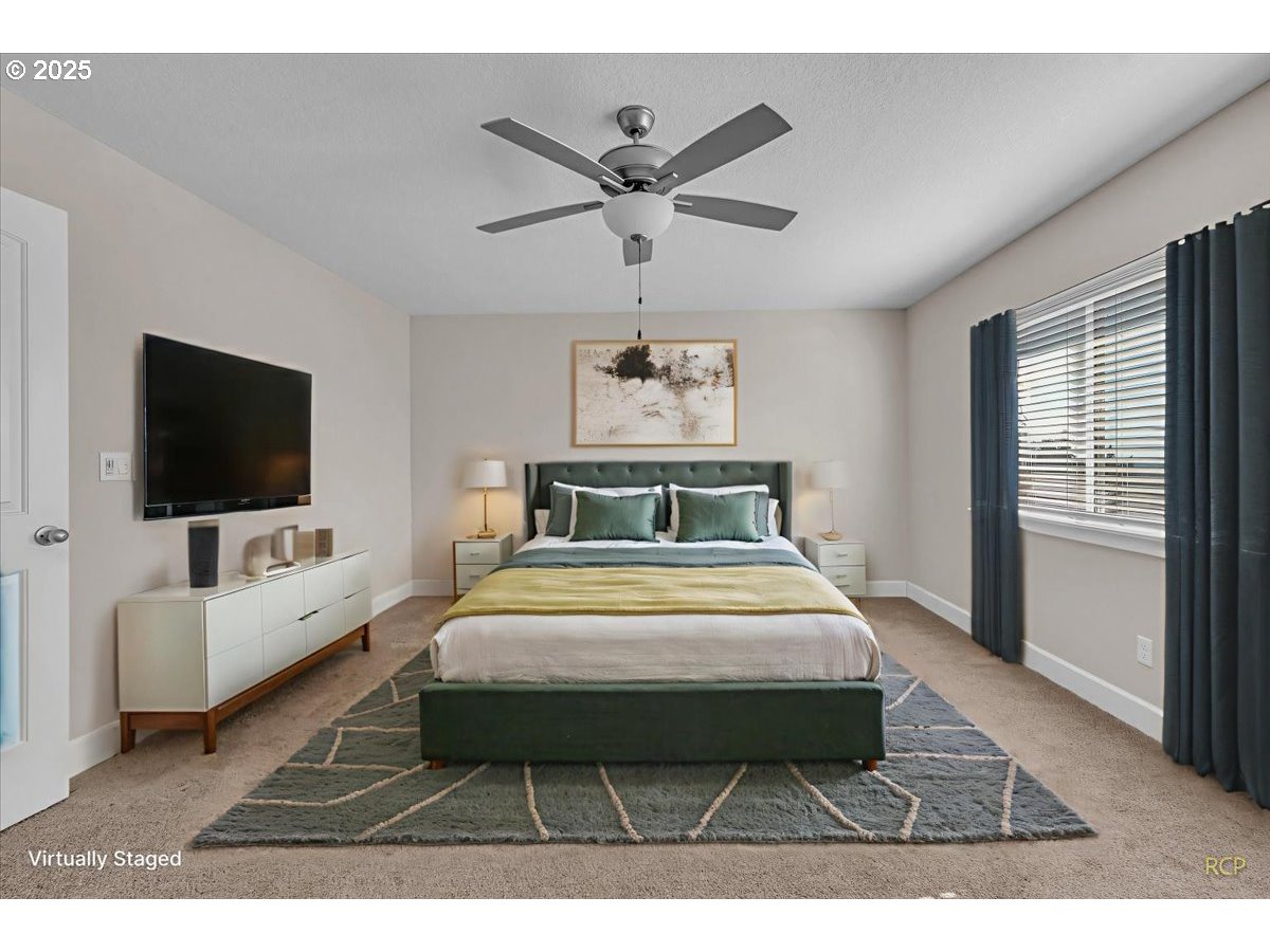 35560 Valley View Drive St. Helens, OR 97051 - Photo 44 of 47 a bedroom with a bed a flat screen tv and couches