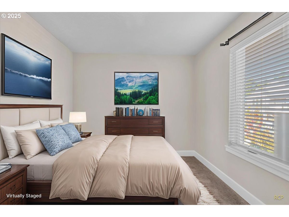 35560 Valley View Drive St. Helens, OR 97051 - Photo 47 of 47 a bedroom with a large bed and a flat screen tv