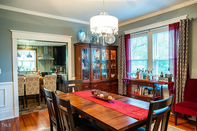 a living room filled with furniture and wooden floor