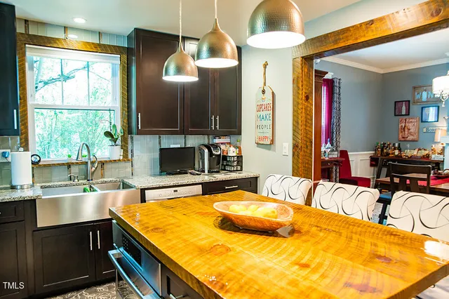 a dining room with furniture and a rug