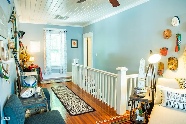 a view of a house with backyard sitting area and garden