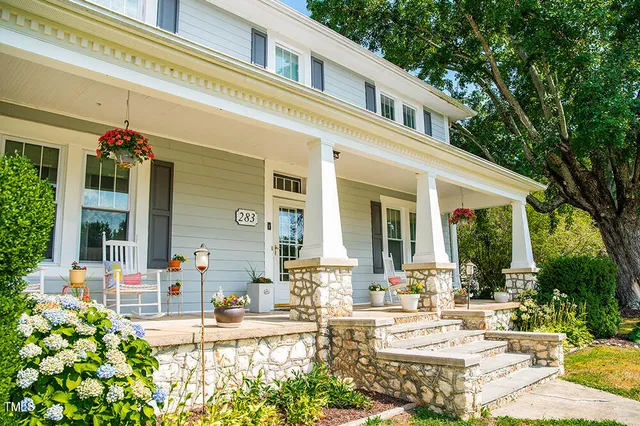 a view of a swimming pool with outdoor seating