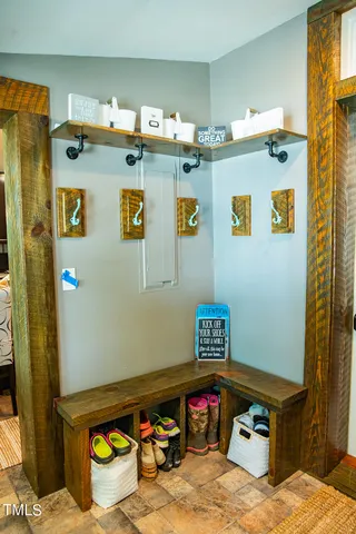 a bedroom with a bed and a mirror