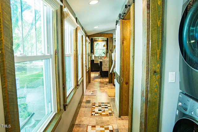 a kitchen with stainless steel appliances granite countertop a refrigerator sink and stove