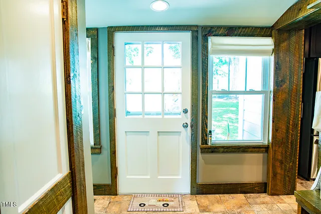 a view of a yard with a tree