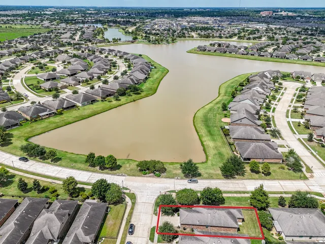 an aerial view of a house with a ocean view