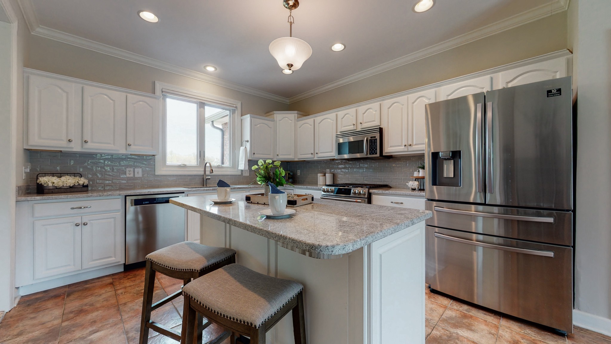 1805 North Lovvorn Road Christiana, TN 37037 - Photo 13 of 54 a kitchen with stainless steel appliances granite countertop a refrigerator a stove a sink dishwasher a stove with white cabinets