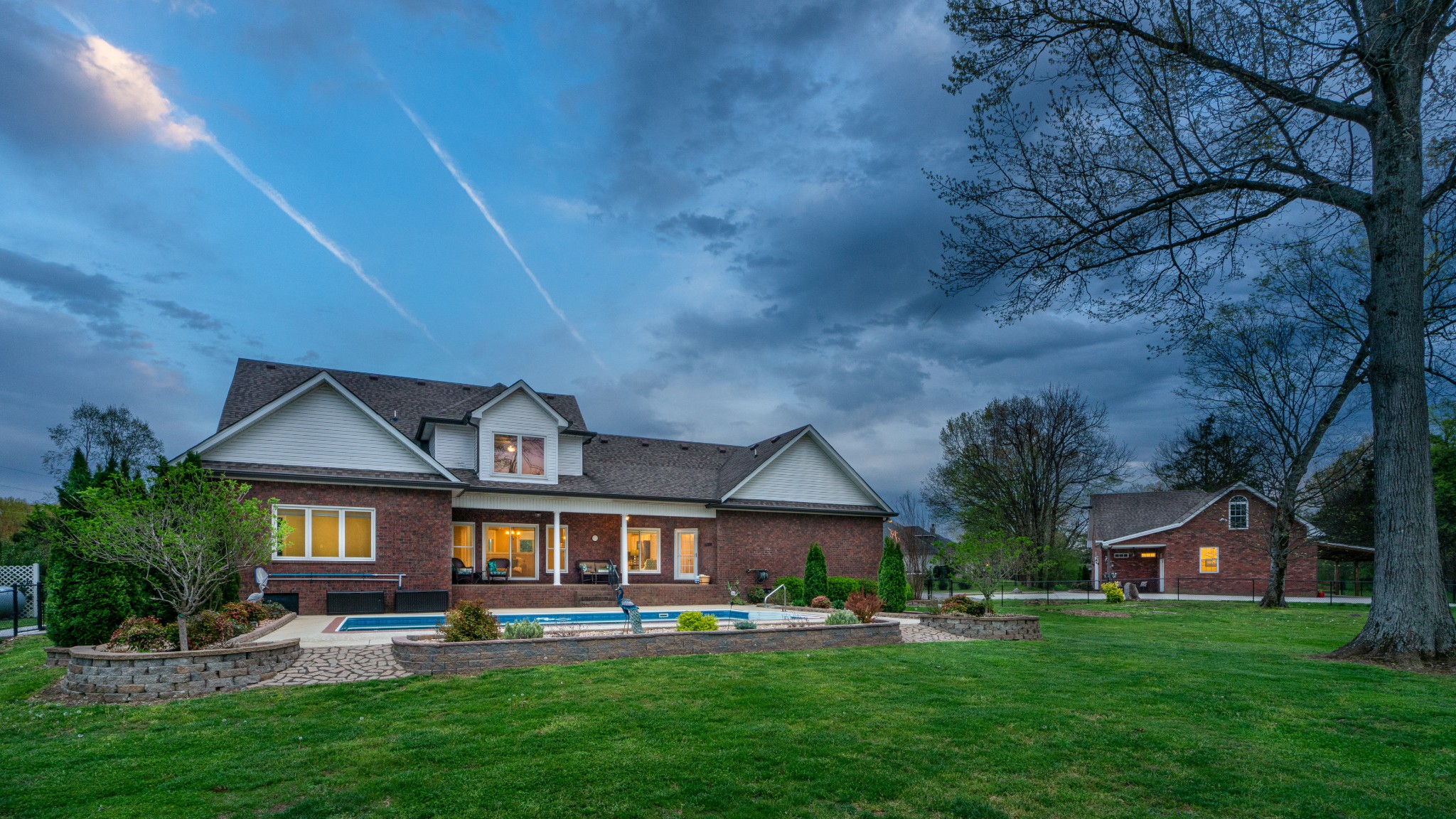 1805 North Lovvorn Road Christiana, TN 37037 - Photo 2 of 54 a front view of a house with a garden and trees