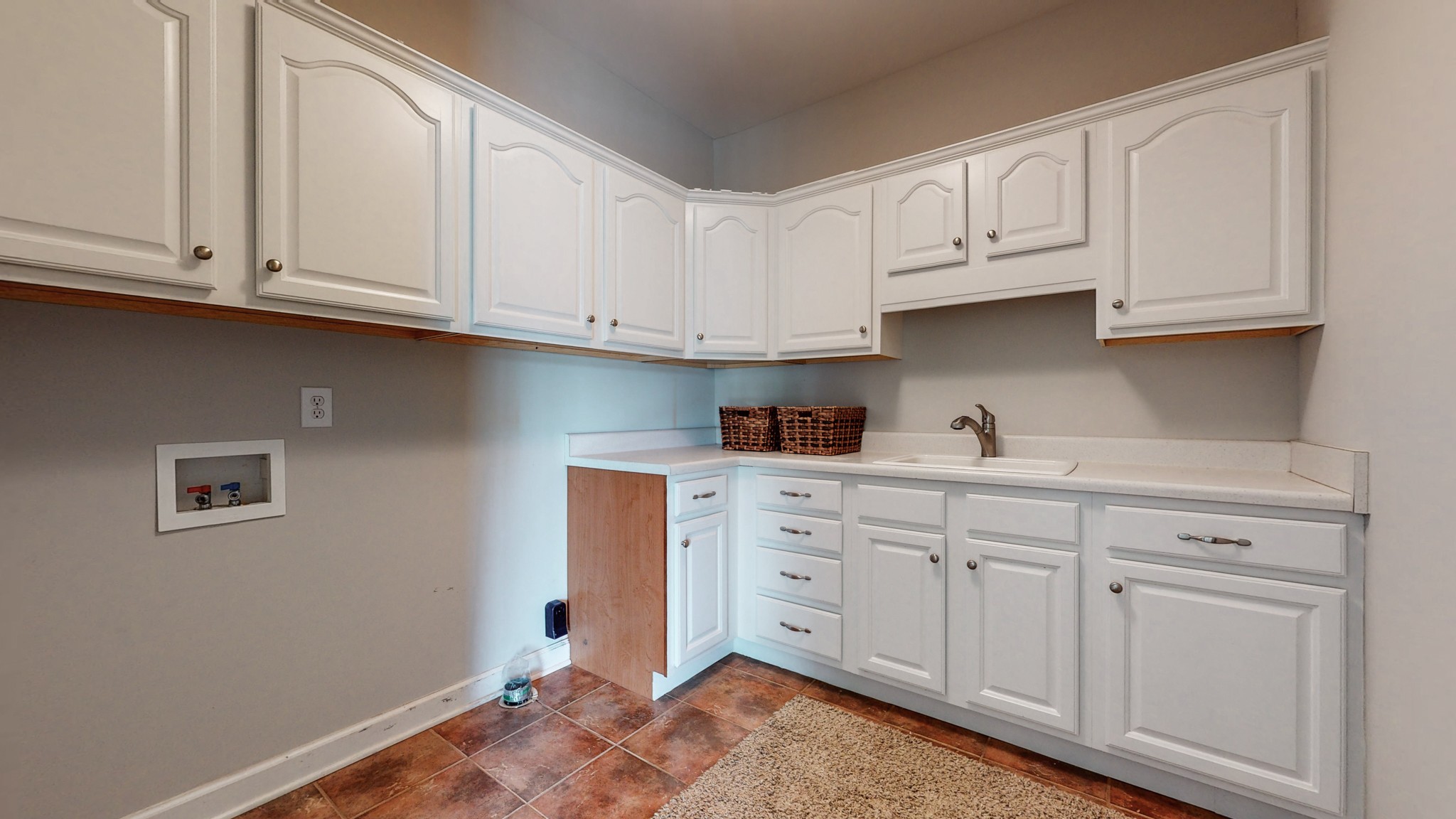 1805 North Lovvorn Road Christiana, TN 37037 - Photo 27 of 54 a kitchen with white cabinets and white appliances