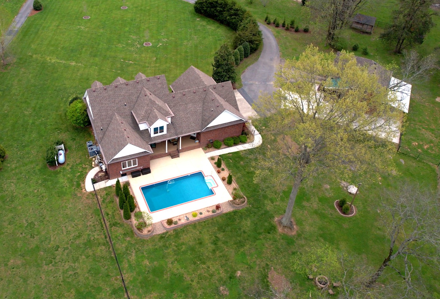 1805 North Lovvorn Road Christiana, TN 37037 - Photo 6 of 54 an aerial view of a house with swimming pool and garden