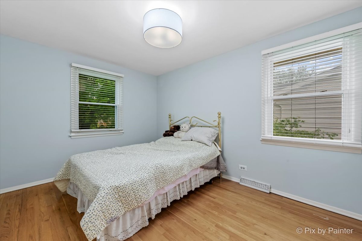 2302 Birch Lane Rolling Meadows, IL 60008 - Photo 16 of 30 a bedroom with a bed and a window