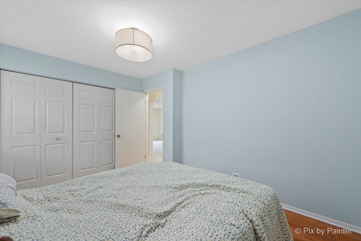 2302 Birch Lane Rolling Meadows, IL 60008 - Photo 17 of 30 a bedroom with a bed and a lamp