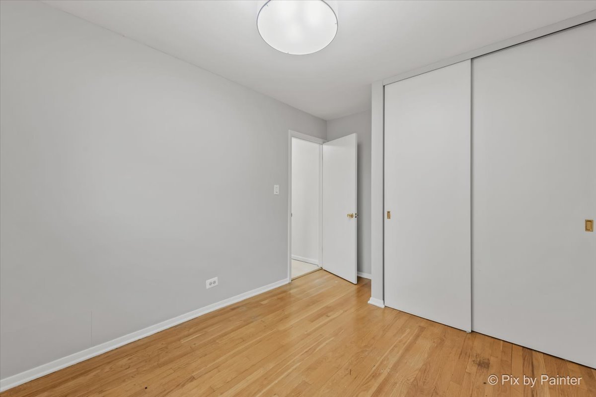 2302 Birch Lane Rolling Meadows, IL 60008 - Photo 19 of 30 a view of a room with wooden floor and white walls
