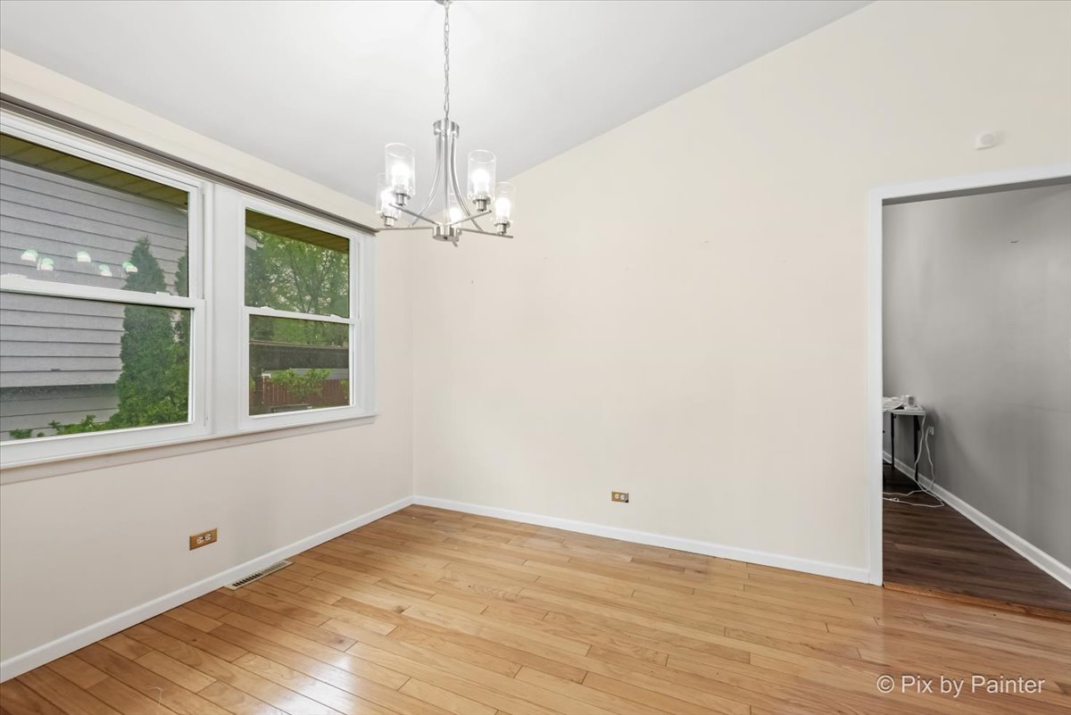 2302 Birch Lane Rolling Meadows, IL 60008 - Photo 8 of 30 a view of empty room with wooden floor and fan