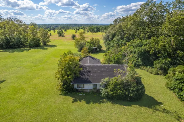 a view of a yard with an outdoor space and seating area